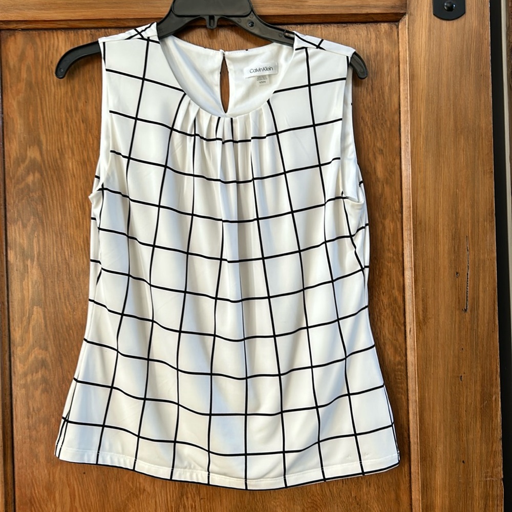 Calvin Klein women’s dress shirt. White with black strip medium